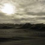 Serene traveler overlooking a black sand beach in Iceland